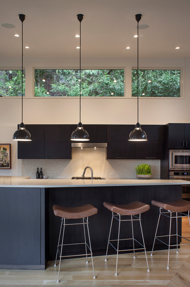 This is an example of a contemporary kitchen in Portland with stainless steel appliances.