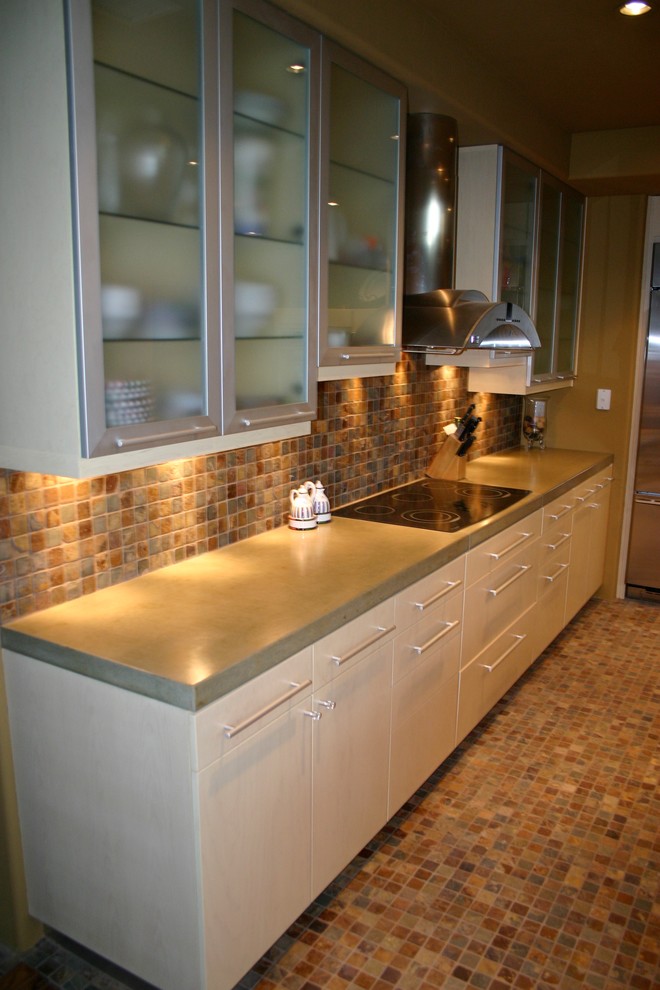 Photo of a large contemporary single-wall enclosed kitchen in Phoenix with a submerged sink, flat-panel cabinets, white cabinets, concrete worktops, multi-coloured splashback, porcelain splashback, stainless steel appliances, no island, porcelain flooring, multi-coloured floors and grey worktops.