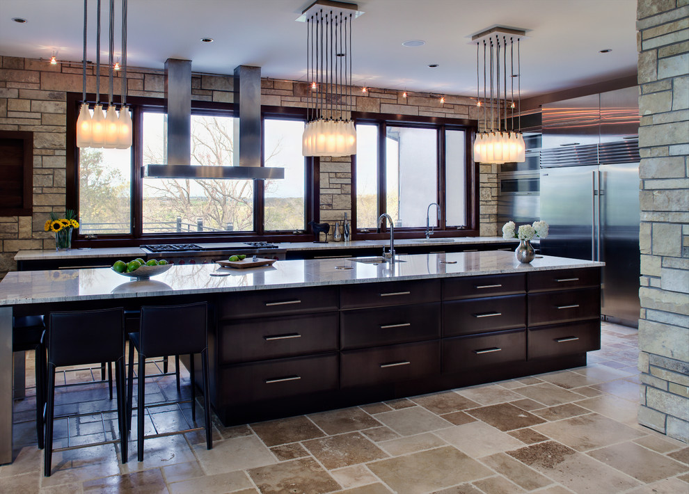 Example of a trendy kitchen design in Chicago with dark wood cabinets and stainless steel appliances