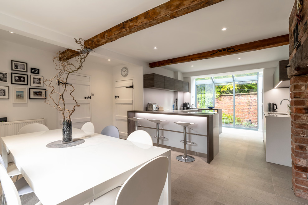 Contemporary kitchen in Cheshire with flat-panel cabinets.