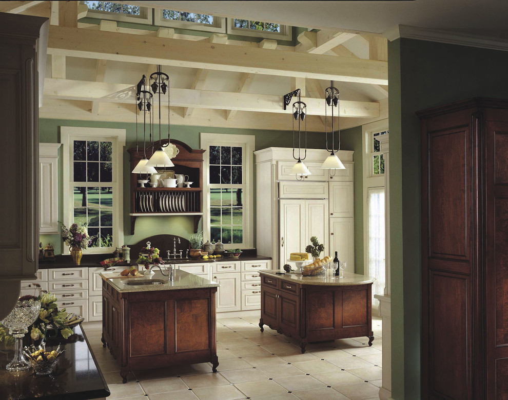 Photo of a large country u-shaped kitchen in Los Angeles with raised-panel cabinets, white cabinets and multiple islands.