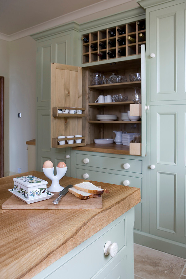 Design ideas for a farmhouse kitchen in Other with beaded cabinets and wood worktops.