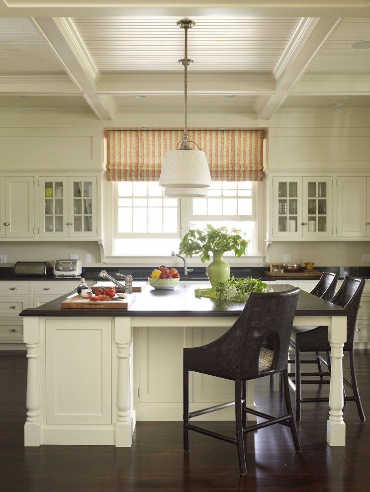 This is an example of a traditional kitchen in New York with recessed-panel cabinets and white cabinets.