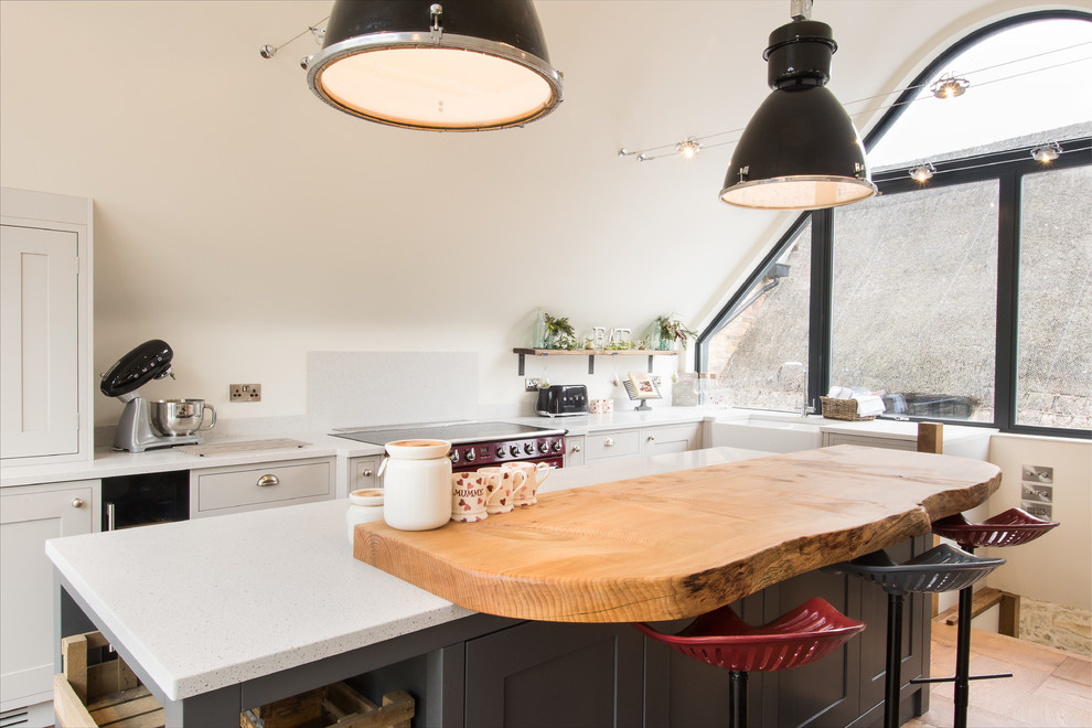 Inspiration for a country l-shaped kitchen/diner in Buckinghamshire with a belfast sink, shaker cabinets, grey cabinets, wood worktops, coloured appliances and an island.