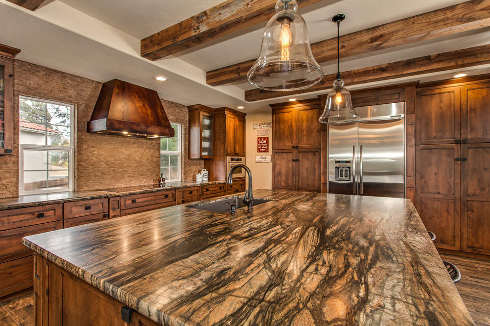 Eat-in kitchen - large country l-shaped medium tone wood floor eat-in kitchen idea in Sacramento with an undermount sink, shaker cabinets, medium tone wood cabinets, granite countertops, beige backsplash, stainless steel appliances and an island