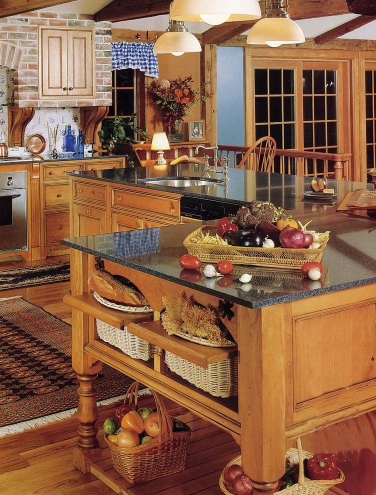 Elegant kitchen photo in New York with granite countertops, an undermount sink, beaded inset cabinets, medium tone wood cabinets and multicolored backsplash
