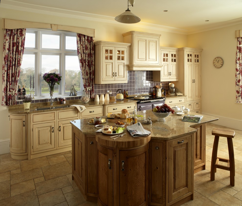 Inspiration for a timeless kitchen remodel in London with raised-panel cabinets