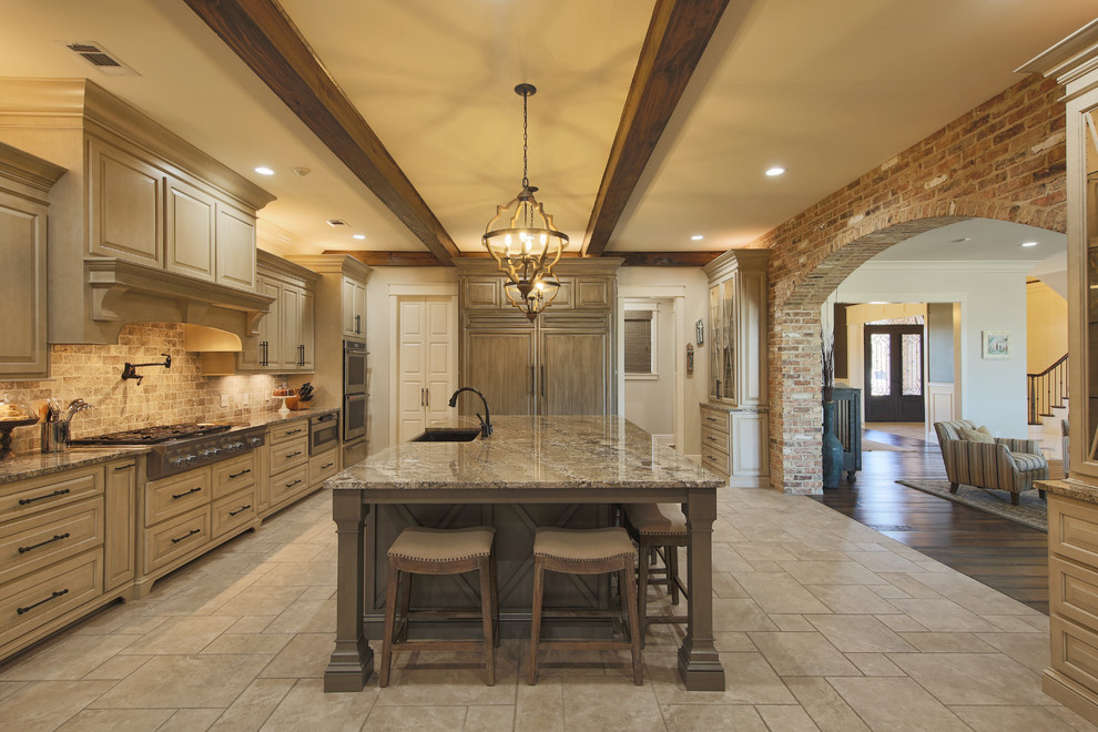 Example of a farmhouse gray floor enclosed kitchen design in Other with raised-panel cabinets, gray cabinets, beige backsplash, paneled appliances, an island and gray countertops