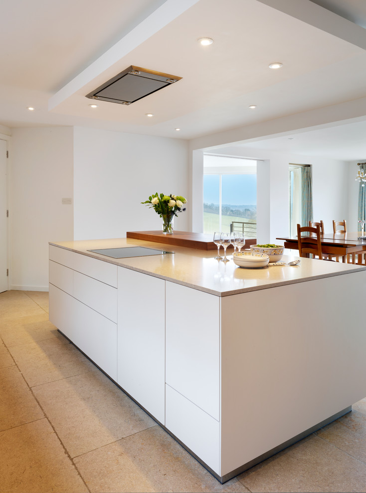 Photo of a large contemporary open plan kitchen in Other with an integrated sink, flat-panel cabinets, medium wood cabinets, quartz worktops, white splashback, stainless steel appliances, ceramic flooring and an island.