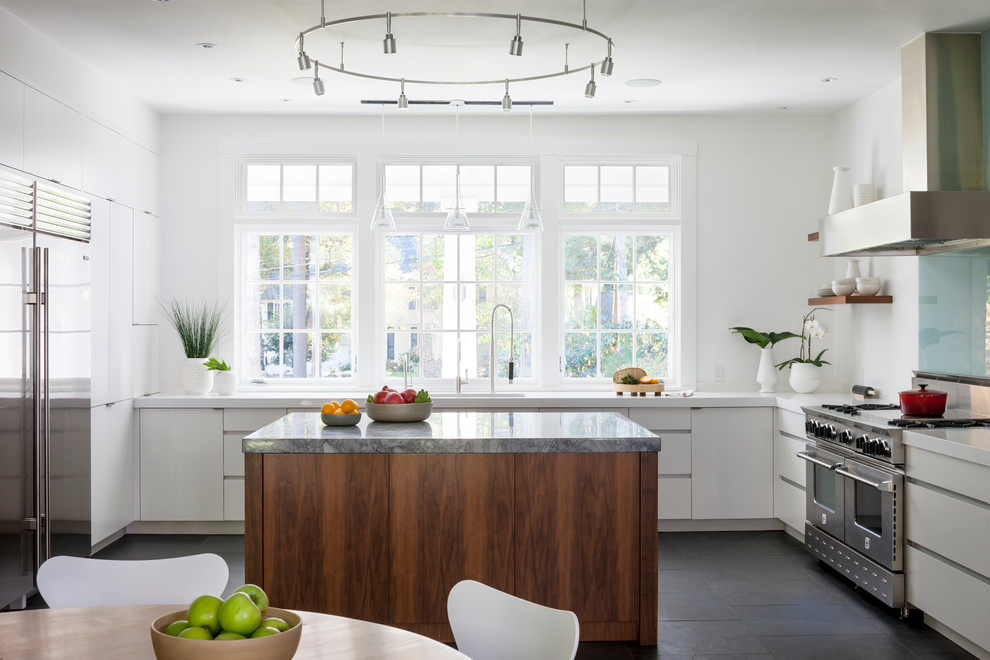 This is an example of a contemporary kitchen in Boston with stainless steel appliances.