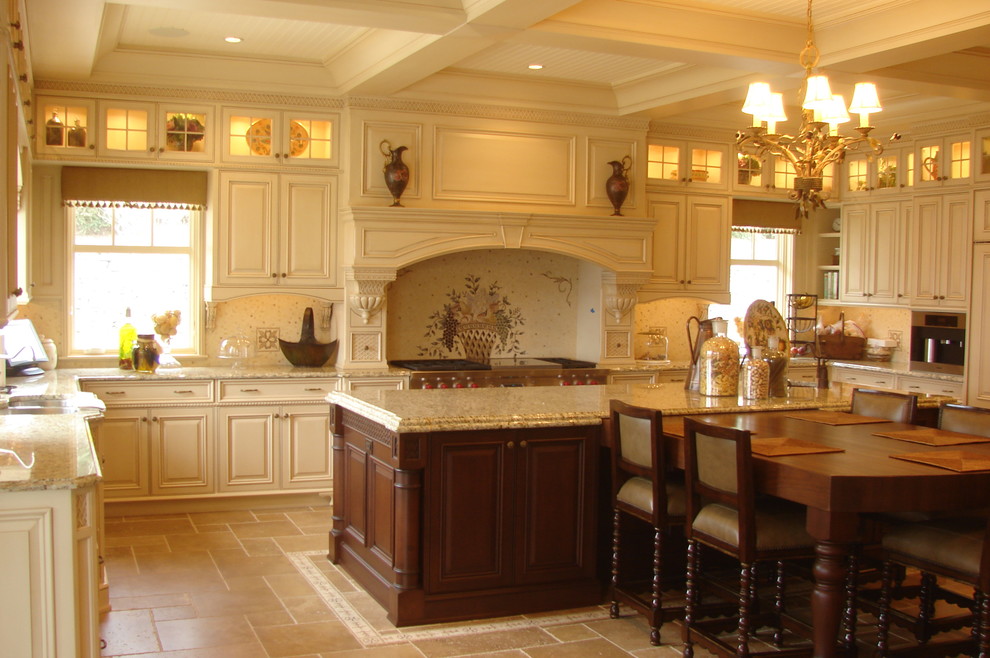Example of a classic u-shaped kitchen design in Other with an undermount sink, raised-panel cabinets, white cabinets and an island