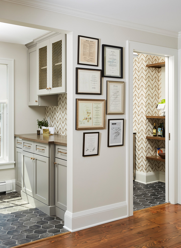 This is an example of a medium sized traditional kitchen pantry in Minneapolis with recessed-panel cabinets, grey cabinets, porcelain flooring, grey floors and white worktops.