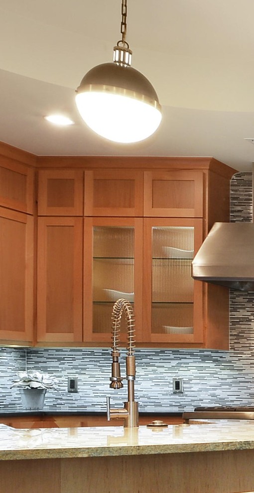 Kitchen - craftsman kitchen idea in Austin with glass-front cabinets