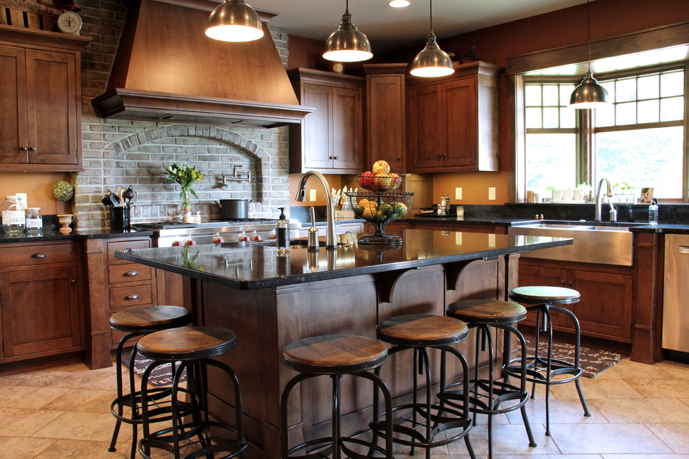 Inspiration for a large craftsman porcelain tile enclosed kitchen remodel in Other with a farmhouse sink, recessed-panel cabinets, medium tone wood cabinets, quartz countertops, stainless steel appliances, an island, brick backsplash and black countertops