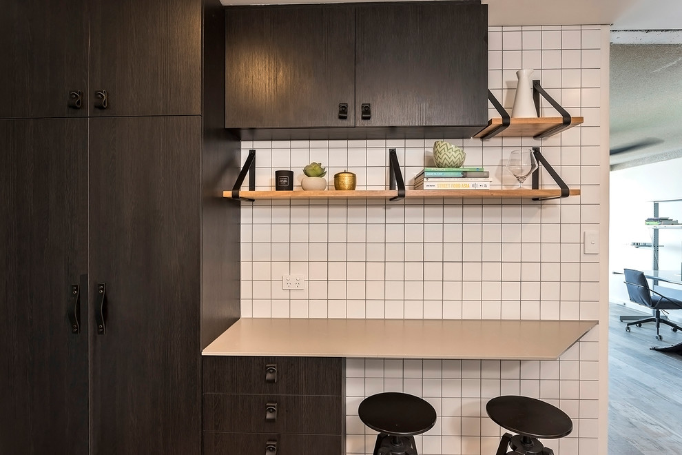 This is an example of a medium sized scandinavian kitchen in Perth with flat-panel cabinets, black cabinets, engineered stone countertops, white splashback, ceramic splashback and grey worktops.