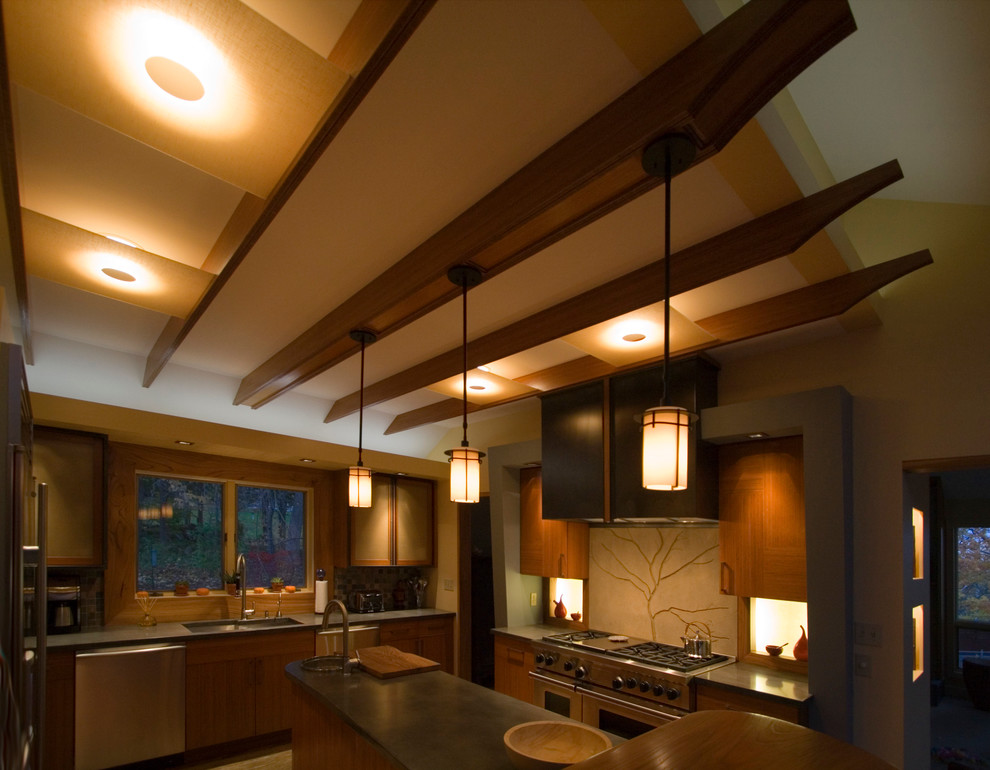 Esempio di una cucina design di medie dimensioni con lavello sottopiano, ante lisce, top in cemento, elettrodomestici in acciaio inossidabile e parquet chiaro