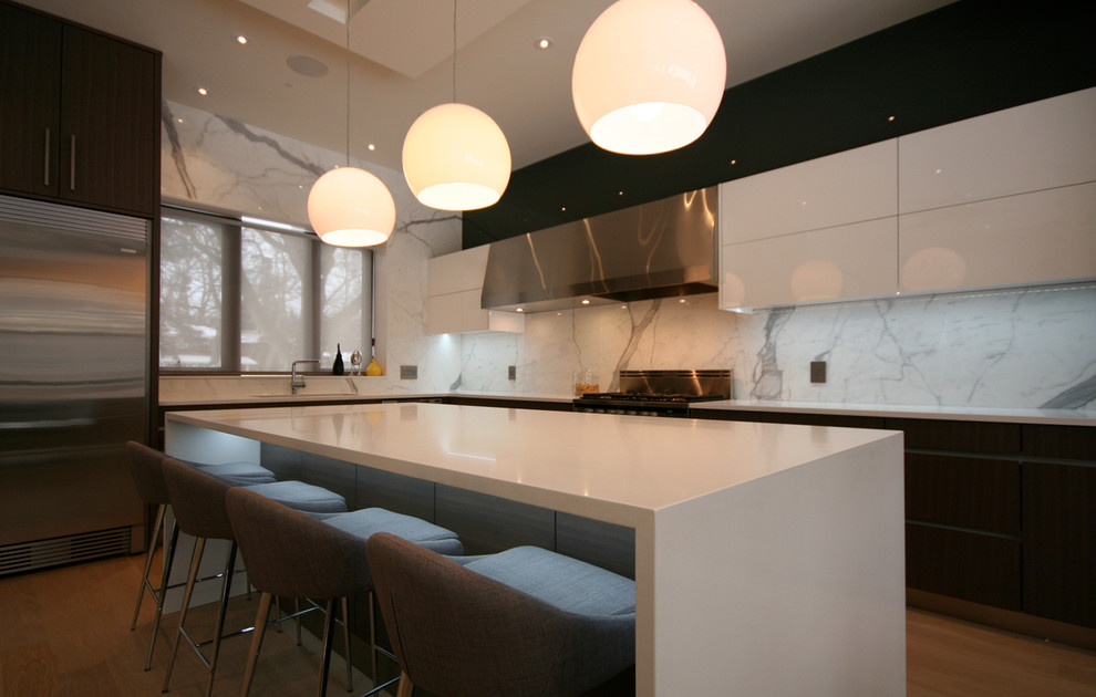 Example of a large trendy galley light wood floor eat-in kitchen design in Toronto with an undermount sink, flat-panel cabinets, dark wood cabinets, quartz countertops, white backsplash, porcelain backsplash, stainless steel appliances and an island