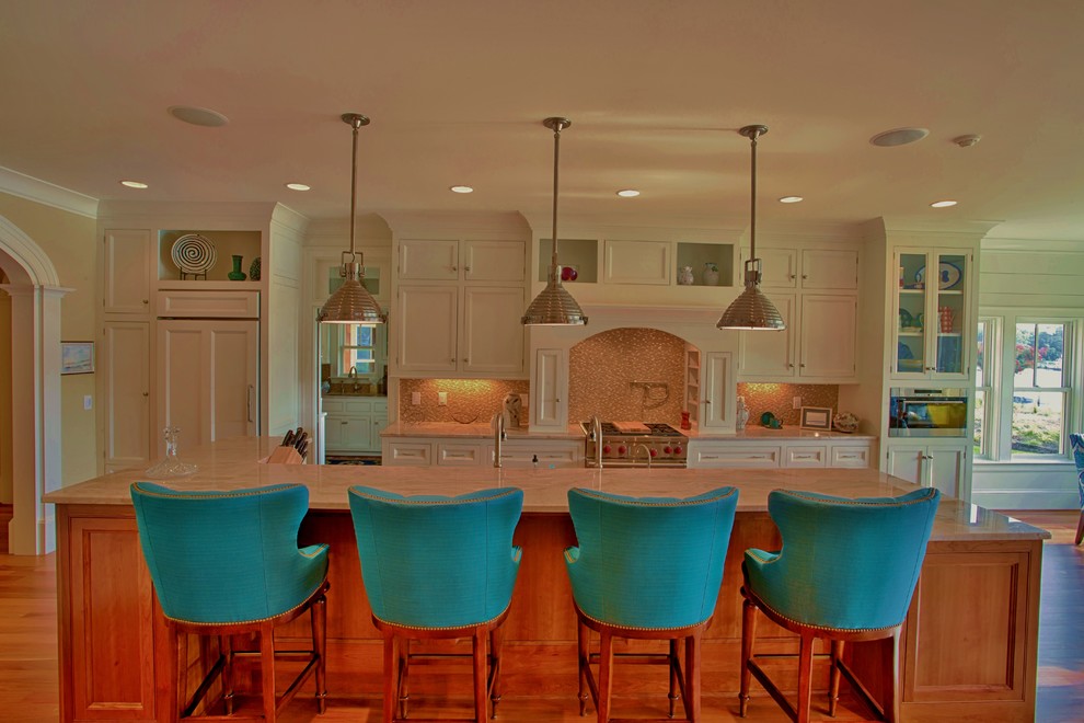Large beach style single-wall medium tone wood floor eat-in kitchen photo in Atlanta with an undermount sink, beaded inset cabinets, white cabinets, granite countertops, beige backsplash, glass tile backsplash, stainless steel appliances and an island