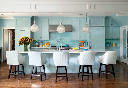 Kitchens and Bathrooms: airy aqua-blue shaker kitchen with island, white countertop, glass pendants, striped stools, and subway-tile backsplash.