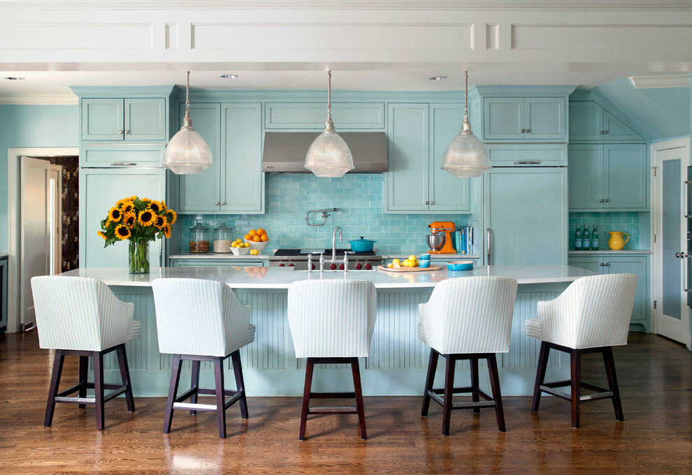 Open concept kitchen - transitional galley dark wood floor open concept kitchen idea in Little Rock with shaker cabinets, blue cabinets, marble countertops, blue backsplash, subway tile backsplash, stainless steel appliances and an island