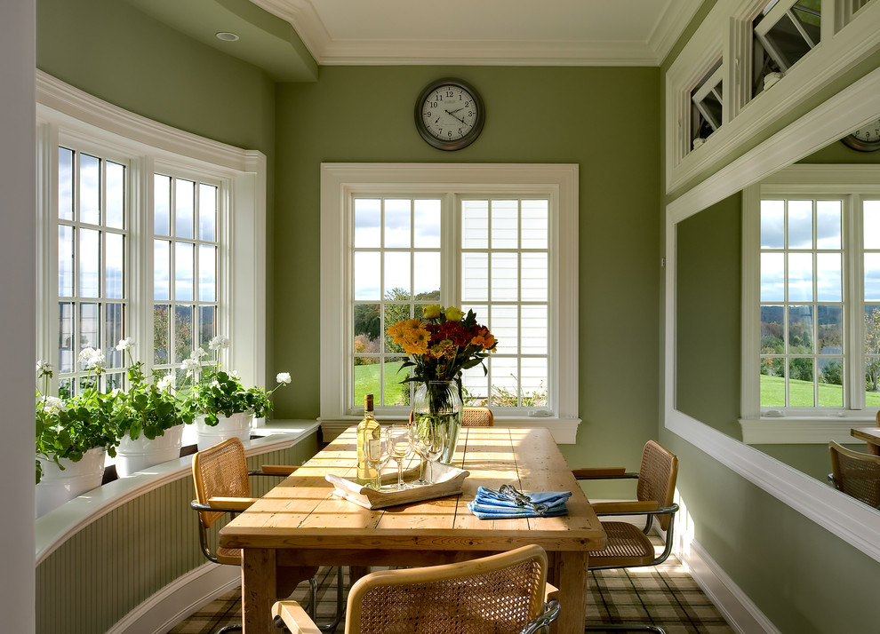 Eat-in kitchen - traditional eat-in kitchen idea in New York with an undermount sink, glass-front cabinets, white cabinets, wood countertops, white backsplash and white appliances