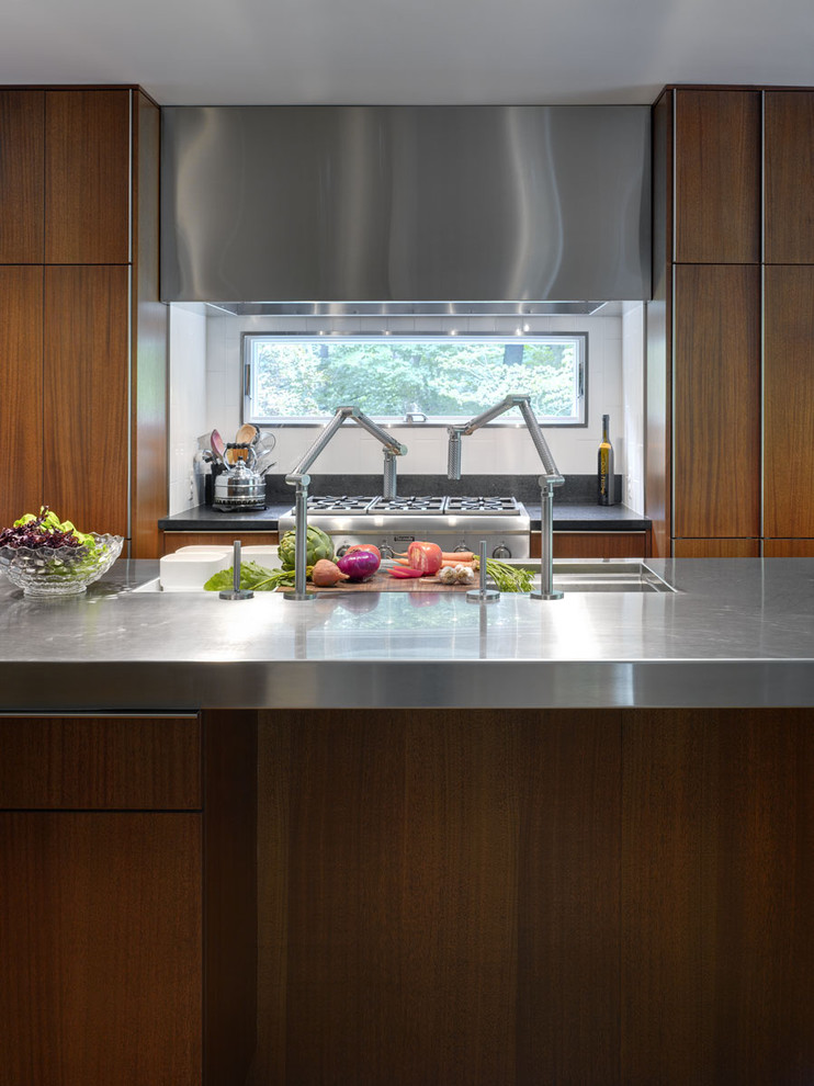 Eat-in kitchen - modern eat-in kitchen idea in Cincinnati with a single-bowl sink, flat-panel cabinets, medium tone wood cabinets, stainless steel countertops and stainless steel appliances