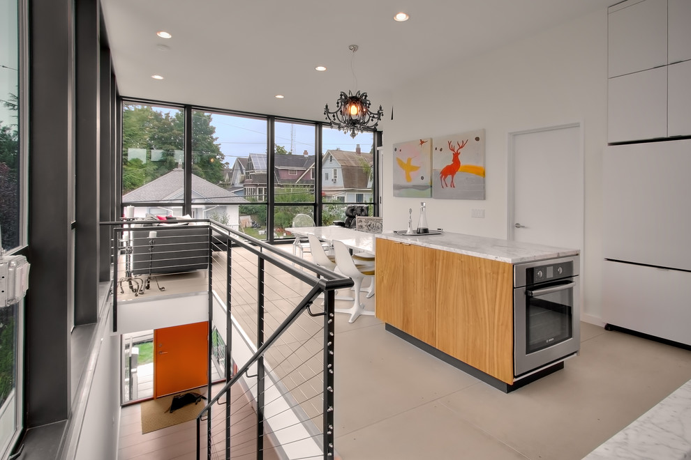 Modern kitchen in Seattle with marble worktops.