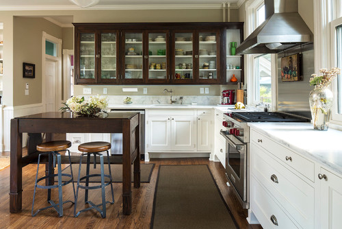 Classic kitchen with white base cabinets and glass-front uppers in polyurethane (PU) finish, paired with stainless steel appliances
