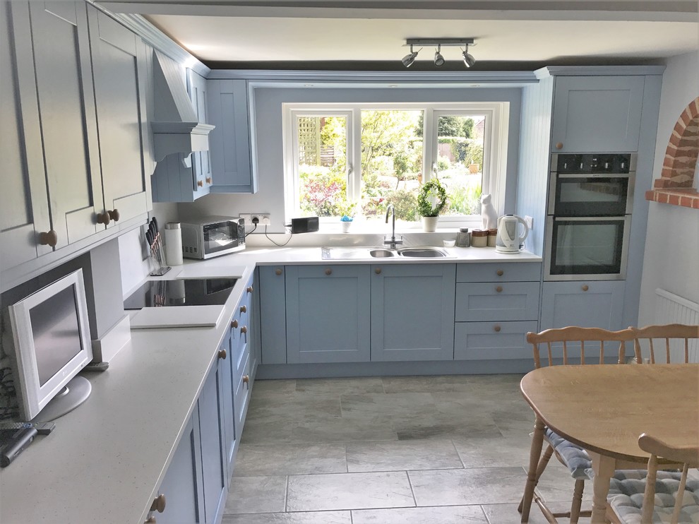 Crown Imperial Midsomer Kitchen in Mid Blue with Minerva Ice Crystal worktops Farmhouse
