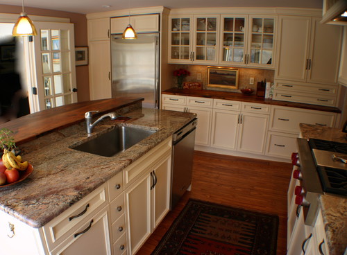 Kitchen island featuring granite countertops 