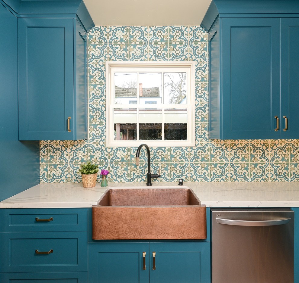 Example of a tuscan terra-cotta tile kitchen design in Sacramento with shaker cabinets, turquoise cabinets, solid surface countertops, an island and white countertops