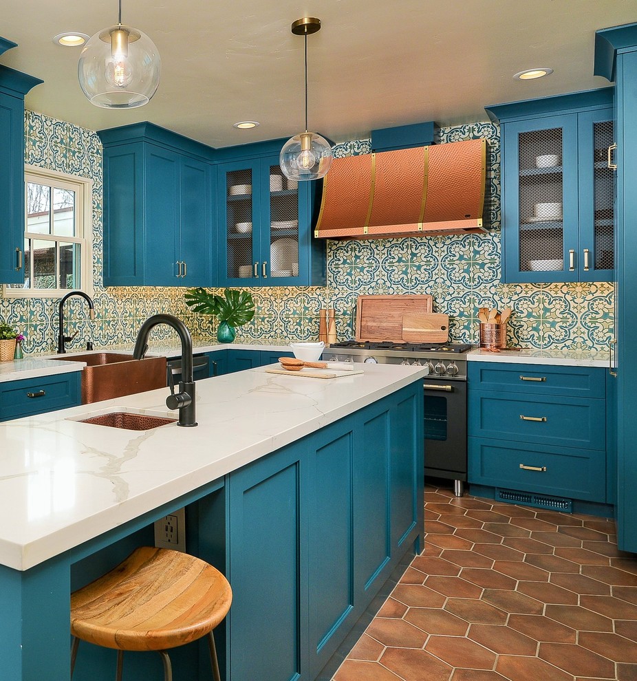 Kitchen - mediterranean terra-cotta tile kitchen idea in Sacramento with shaker cabinets, turquoise cabinets, solid surface countertops, an island and white countertops