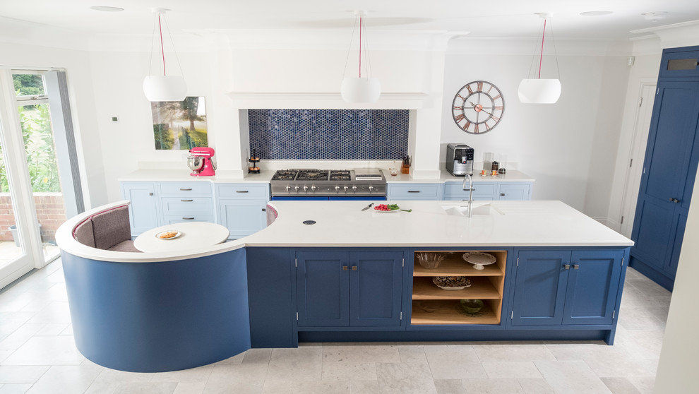Inspiration for a large traditional single-wall open plan kitchen in Cardiff with shaker cabinets, blue cabinets, quartz worktops, blue splashback, mosaic tiled splashback, coloured appliances, limestone flooring, an island and grey floors.