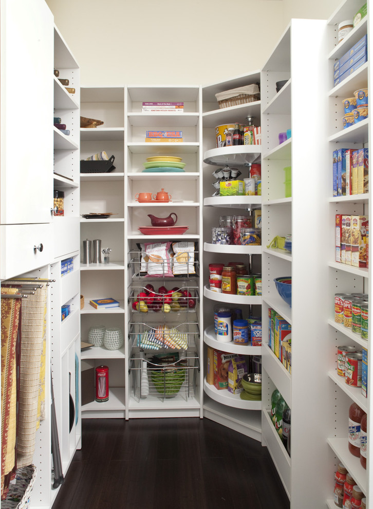 Example of a mid-sized classic dark wood floor kitchen pantry design in Philadelphia with open cabinets and white cabinets