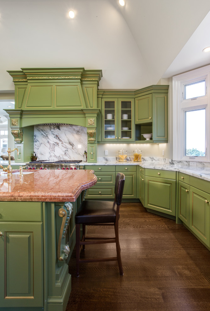 Inspiration for a timeless u-shaped dark wood floor kitchen remodel in San Francisco with raised-panel cabinets, green cabinets, white backsplash, stainless steel appliances and an island