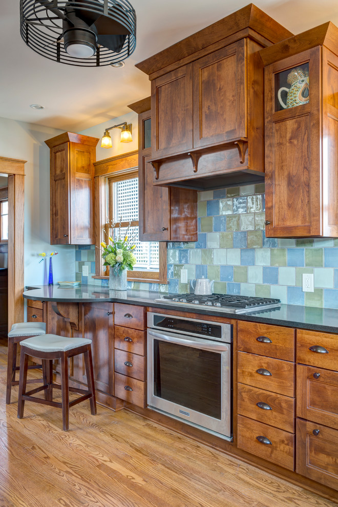 Custom hood with multicolored backsplash Craftsman Kitchen