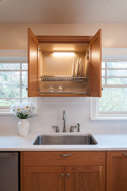 Custom, in-cabinet dish drying rack. Water drips directly into the sink. -  Transitional - Kitchen - Seattle - by Genay Bell Interior Design | Houzz