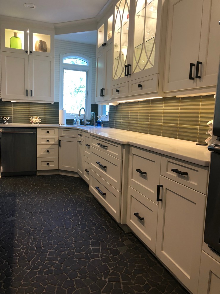 Kitchen - mid-sized transitional u-shaped gray floor kitchen idea in New York with an undermount sink, shaker cabinets, white cabinets, quartzite countertops, green backsplash, matchstick tile backsplash, stainless steel appliances, an island and white countertops
