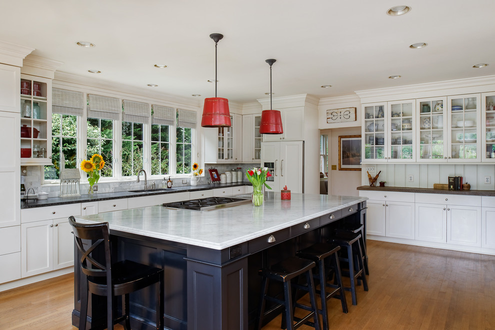 Inspiration for a large timeless u-shaped medium tone wood floor and brown floor eat-in kitchen remodel in DC Metro with an undermount sink, shaker cabinets, white cabinets, soapstone countertops, white backsplash, window backsplash, stainless steel appliances, an island and black countertops