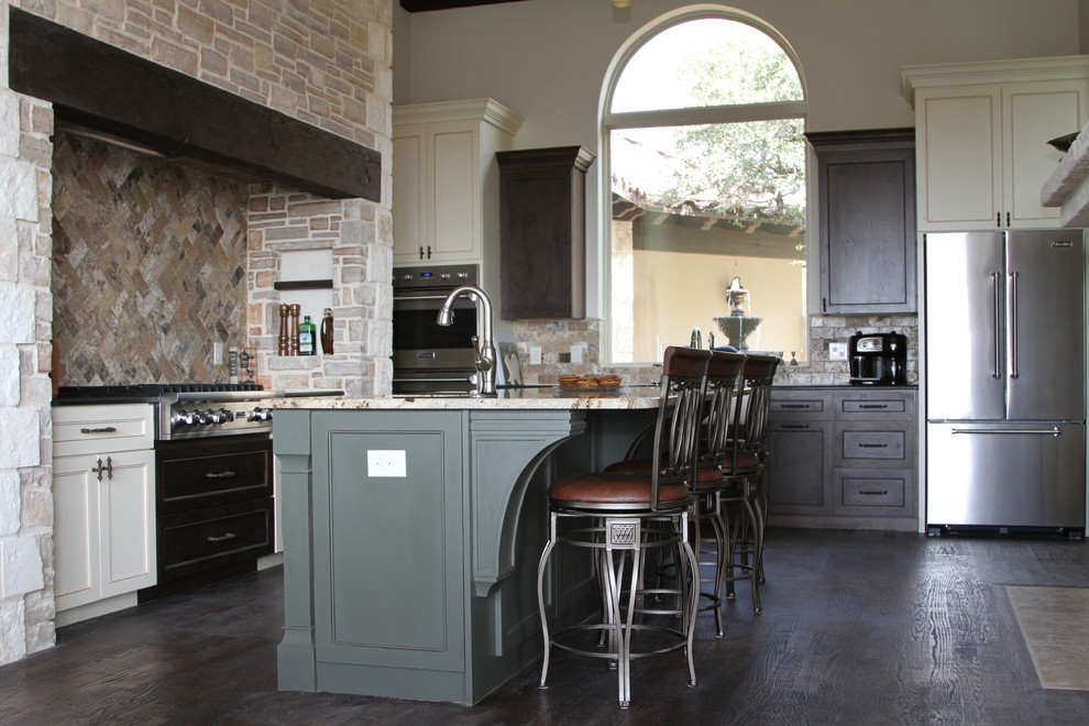 Inspiration for a large timeless l-shaped dark wood floor enclosed kitchen remodel in Austin with a farmhouse sink, recessed-panel cabinets, granite countertops, multicolored backsplash, subway tile backsplash, stainless steel appliances and an island