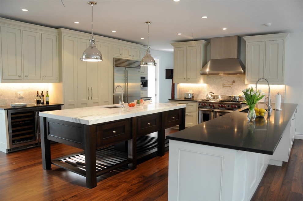 Custom kitchen with island and appliance wall. Transitional Kitchen