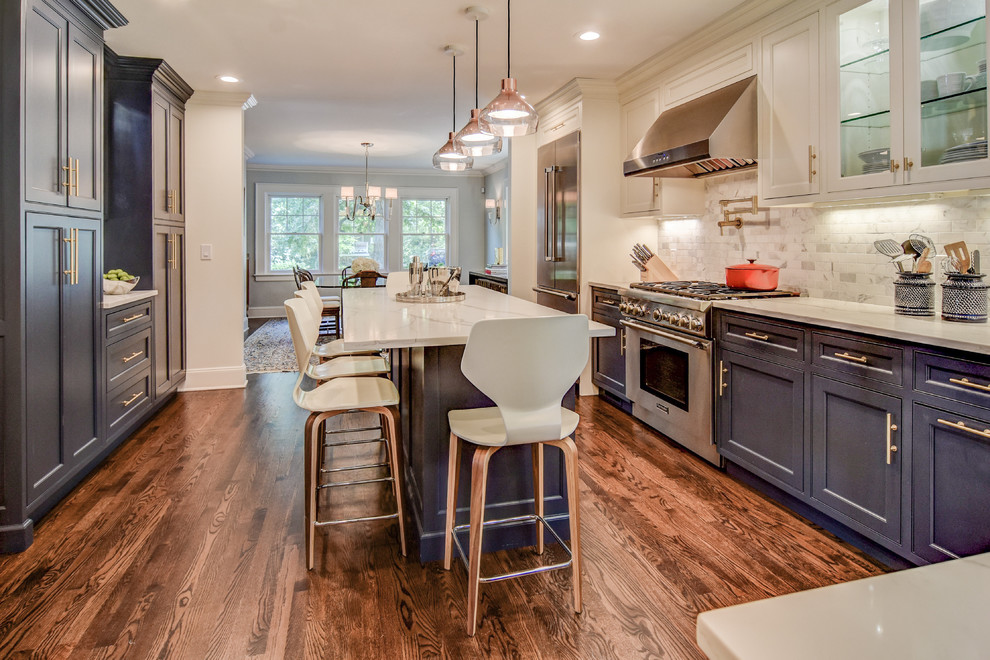 Large elegant l-shaped medium tone wood floor and brown floor eat-in kitchen photo in Newark with an undermount sink, beaded inset cabinets, blue cabinets, quartz countertops, blue backsplash, marble backsplash, stainless steel appliances and an island