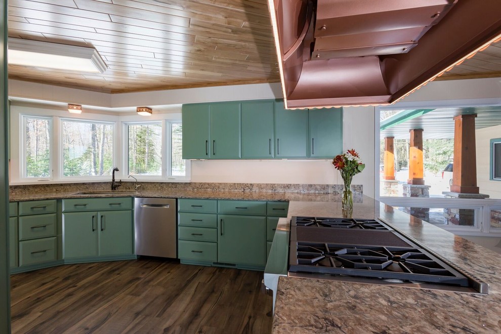 Medium sized classic l-shaped kitchen/diner in Other with a submerged sink, flat-panel cabinets, green cabinets, engineered stone countertops, stainless steel appliances, vinyl flooring, a breakfast bar, brown floors and beige worktops.