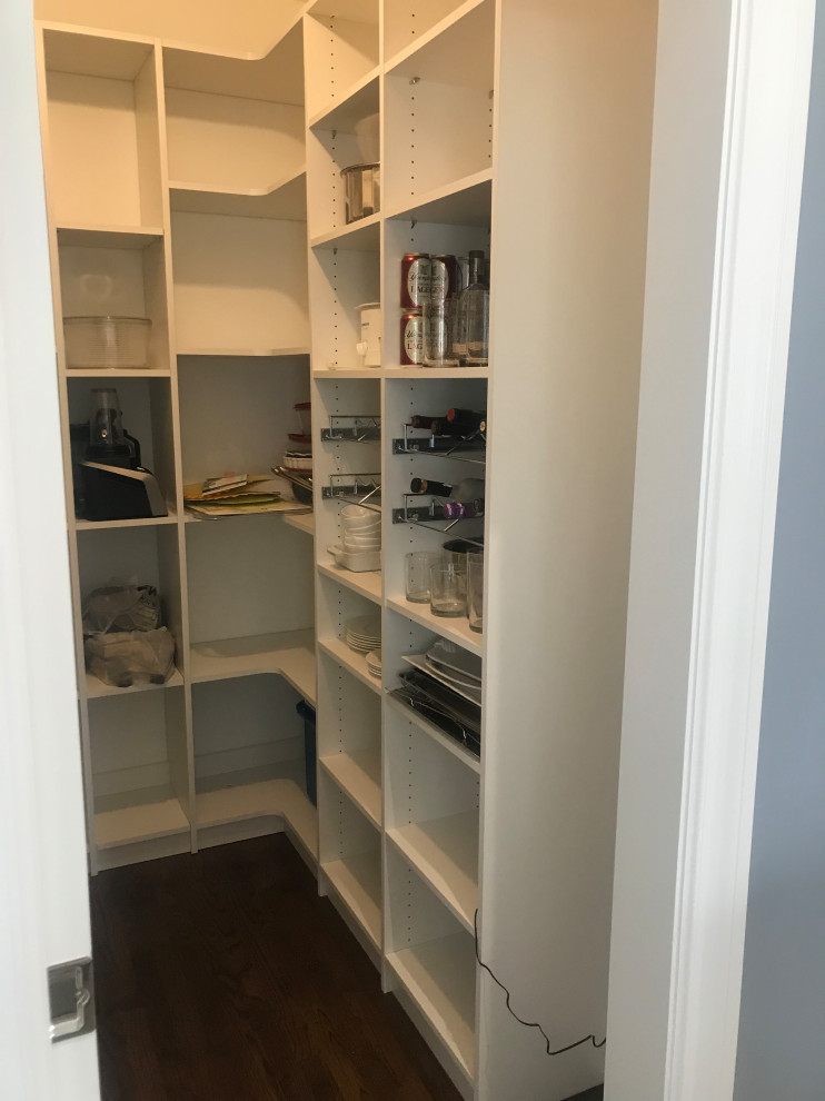 This is an example of a medium sized rural u-shaped kitchen pantry in Other with open cabinets, white cabinets, dark hardwood flooring, no island and brown floors.