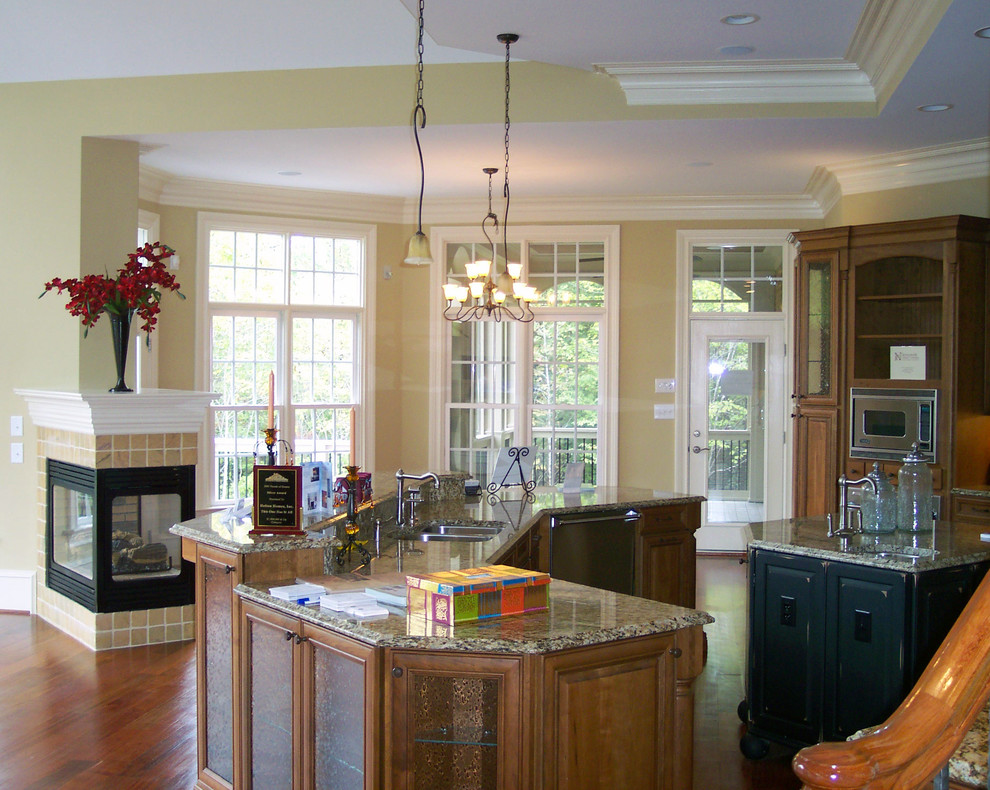 Photo of a kitchen in Raleigh with granite worktops, terracotta splashback, white appliances, travertine flooring and an island.