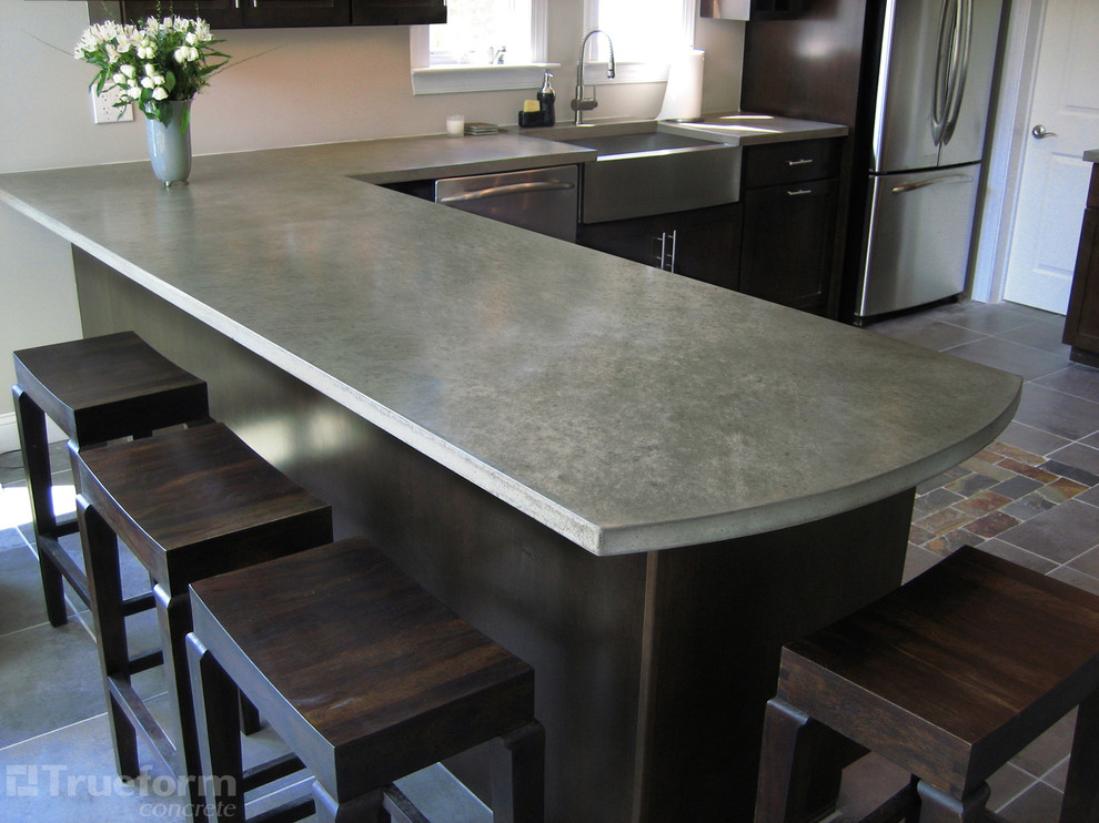 Inspiration for a mid-sized contemporary l-shaped eat-in kitchen remodel in New York with a drop-in sink and no island