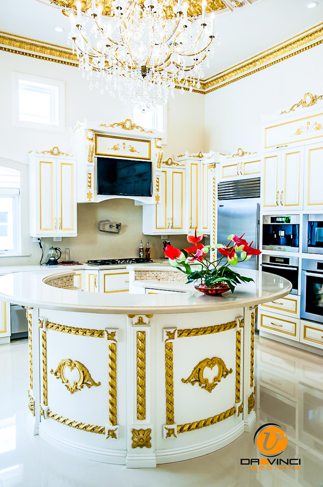 Example of a large classic u-shaped eat-in kitchen design in Miami with white cabinets, recessed-panel cabinets, granite countertops, beige backsplash, stainless steel appliances and an island