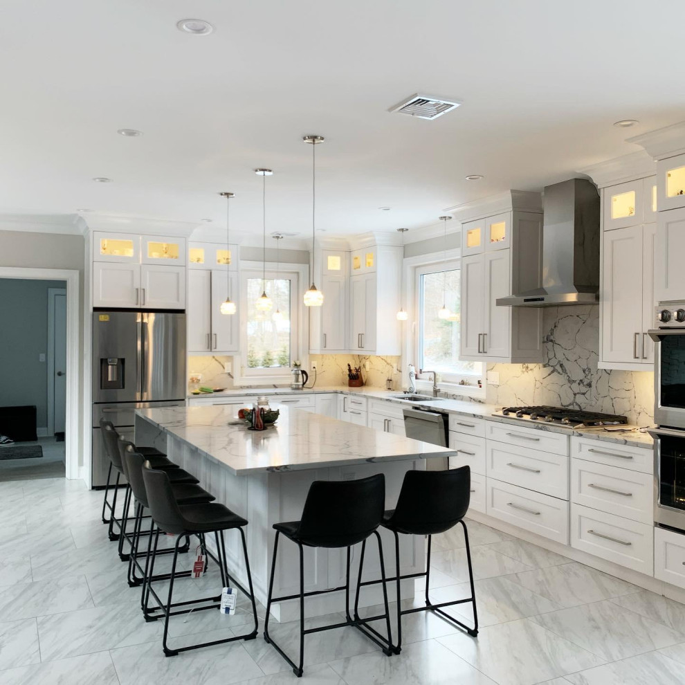 Inspiration for a large modern l-shaped porcelain tile and white floor eat-in kitchen remodel in New York with a single-bowl sink, shaker cabinets, white cabinets, quartzite countertops, white backsplash, marble backsplash, stainless steel appliances, an island and white countertops