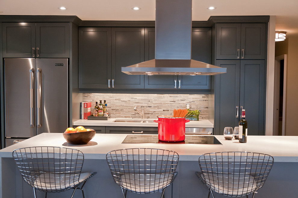 Eat-in kitchen - contemporary galley eat-in kitchen idea in Toronto with an undermount sink, shaker cabinets, gray cabinets, marble countertops, gray backsplash and stainless steel appliances