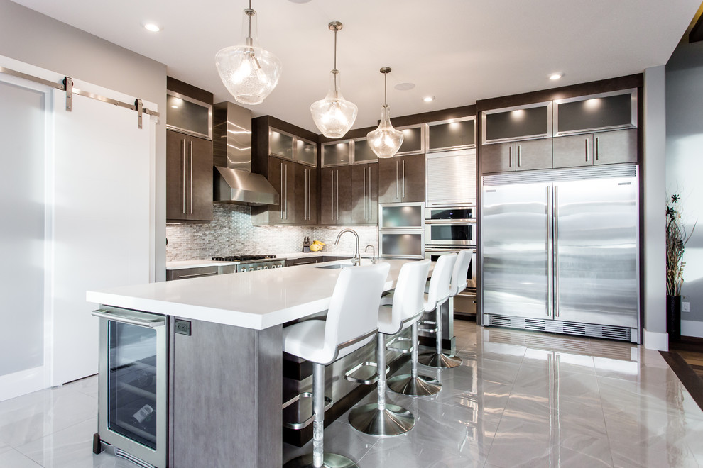 Inspiration for a large contemporary l-shaped ceramic tile and gray floor eat-in kitchen remodel in Calgary with an undermount sink, flat-panel cabinets, brown cabinets, quartz countertops, brown backsplash, mosaic tile backsplash, stainless steel appliances, an island and white countertops